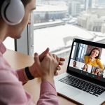 Man having an online video call with coworkers